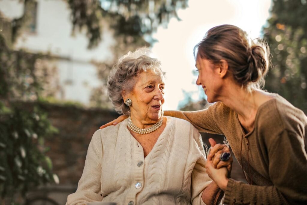 Woman visiting her grandmother in nursing home