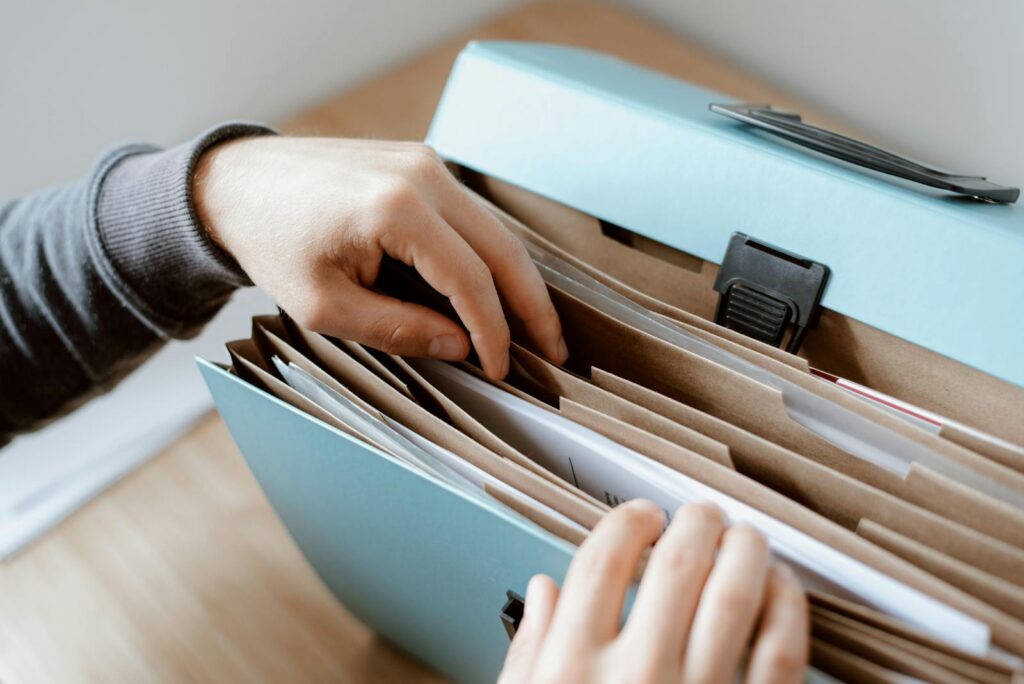 Person lookind for divorce documents in folder