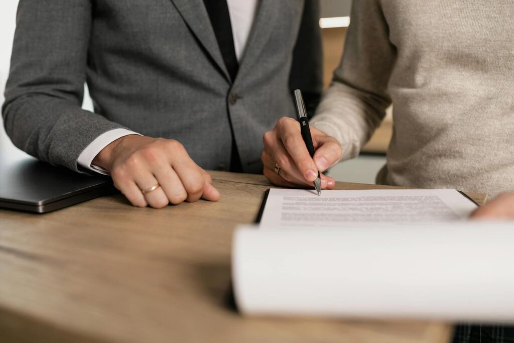 Man signing divorce agreement