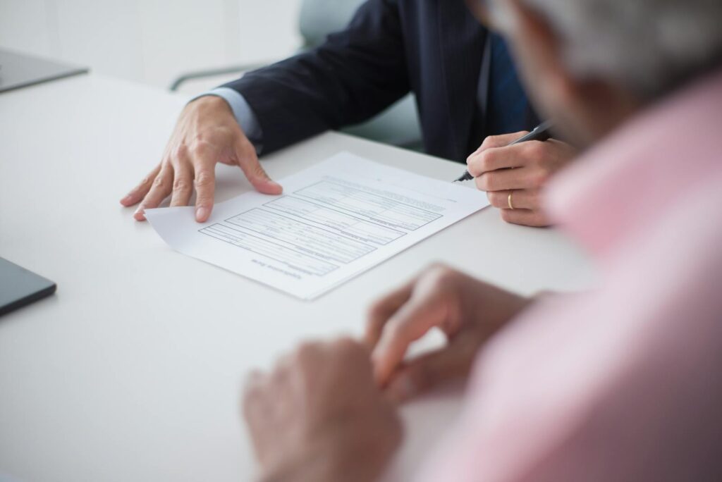 Man Signing Documents