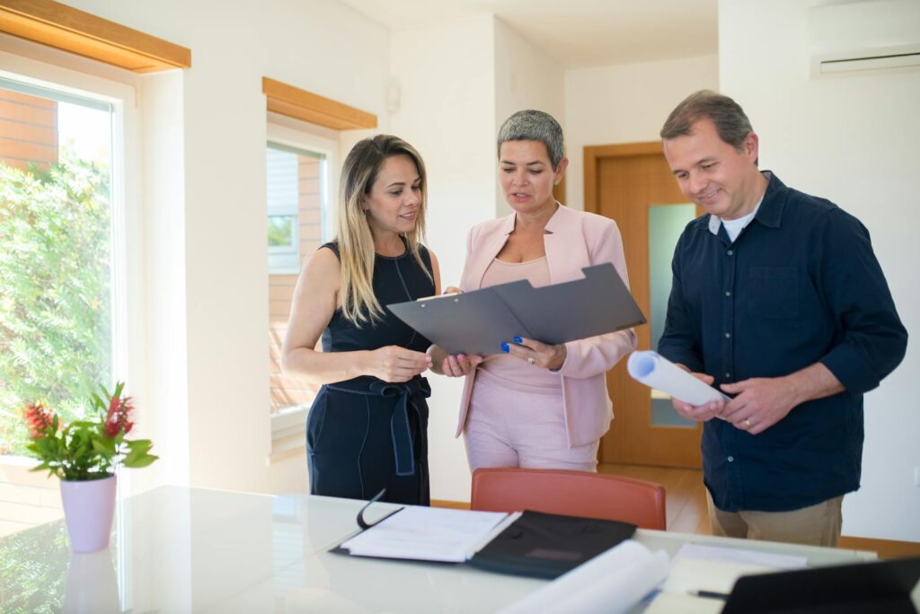 Couple Talking with Real Estate Agent