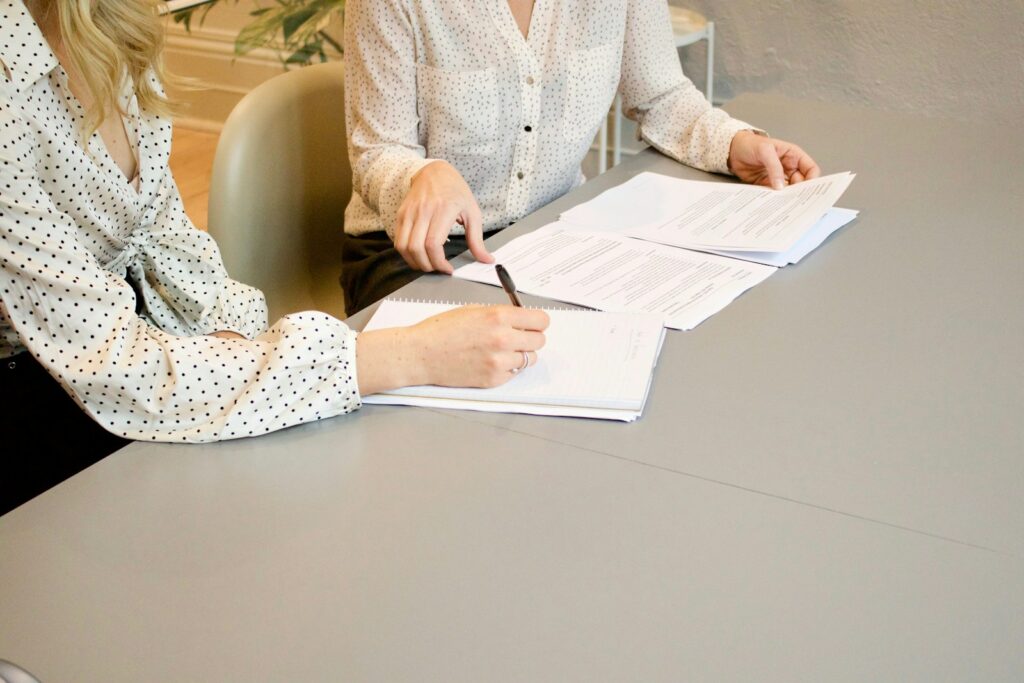 Woman hands over her documents