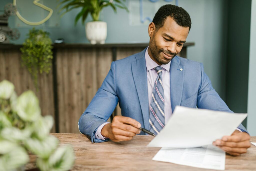 Agent holding real estate papers