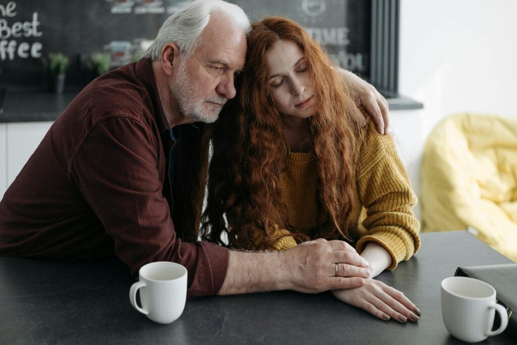 Father and daughter consoling each other