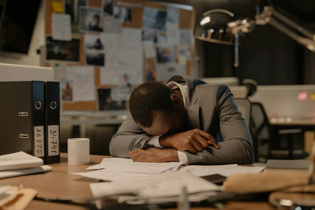 Tired man looking into documents