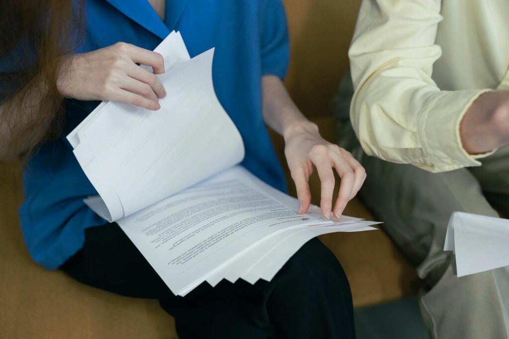 Woman looking through divorce papers