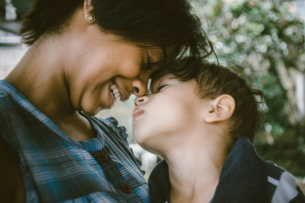 Mother with child hugging