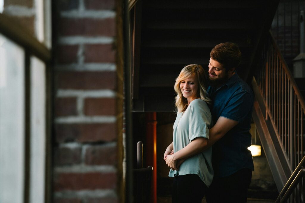 Man hugging woman