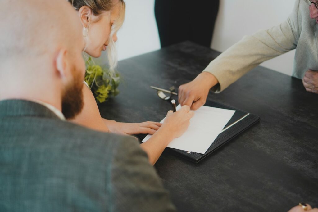 Lawyer showing where to sign divorce paper