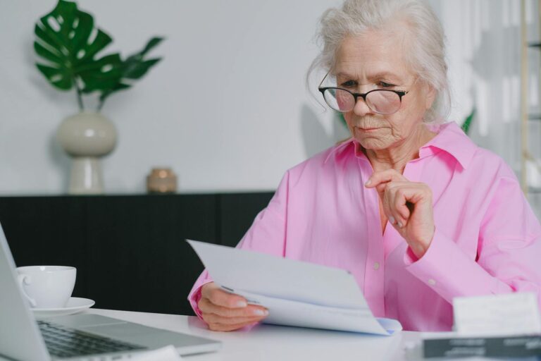 Elderly woman writing her will