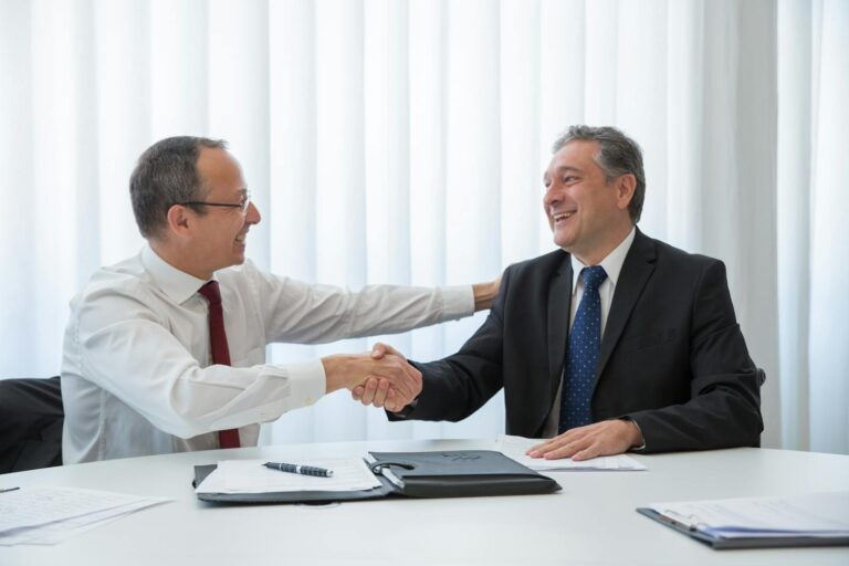 Men shaking hands in the office