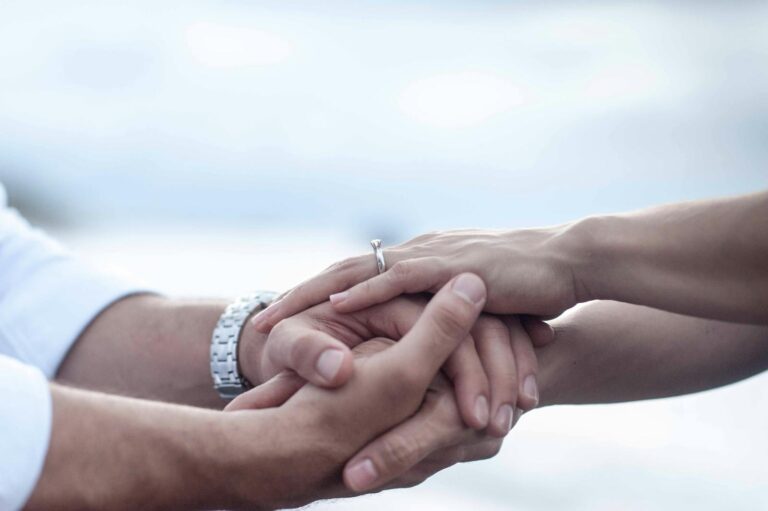 Couple holding hands durring wedding