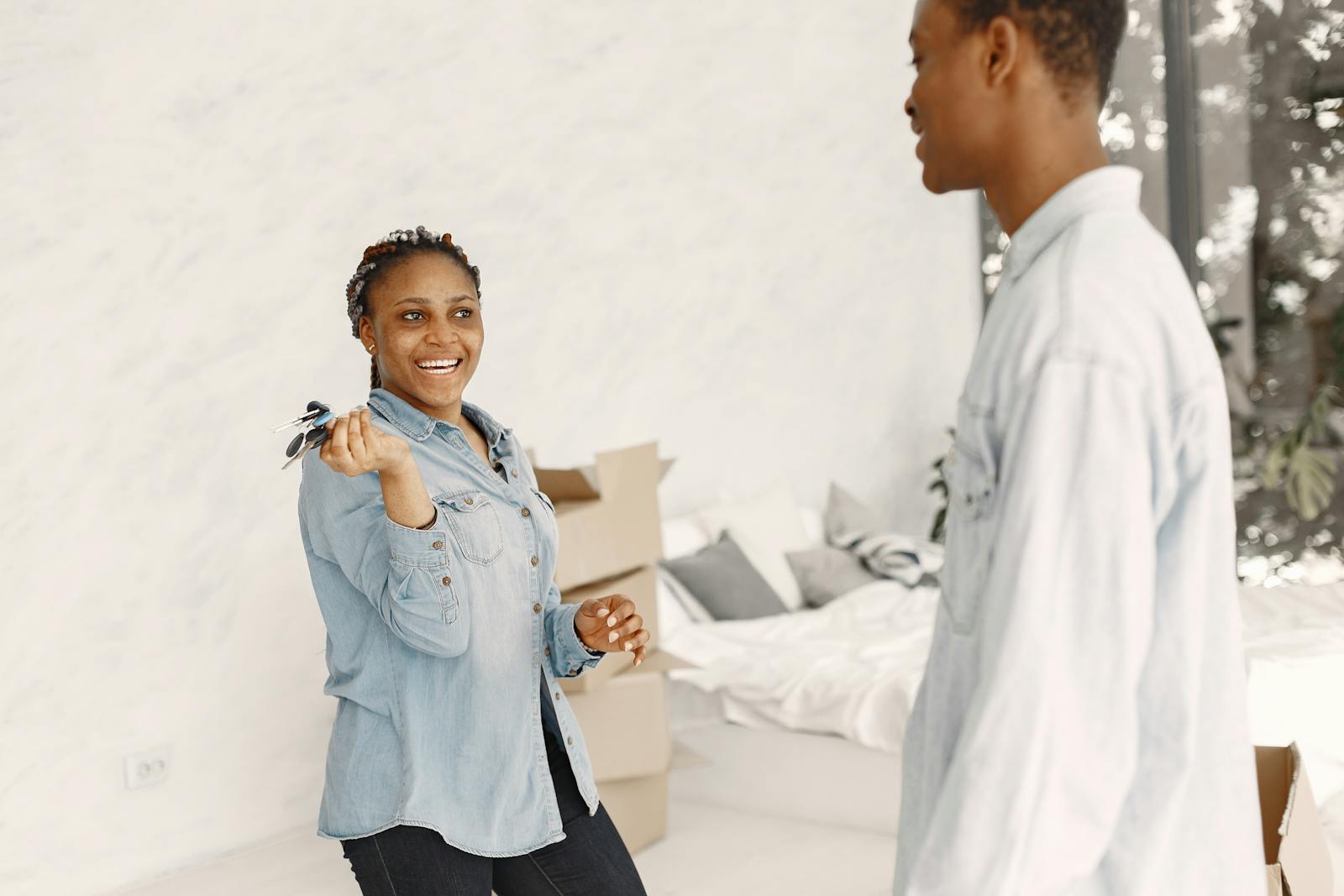 Happy woman holding keys