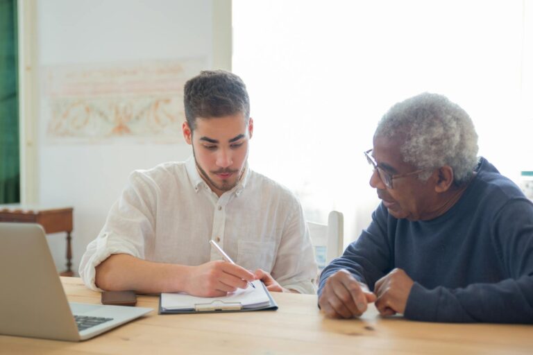 Man preparing Power of Attorney for Elderly Man