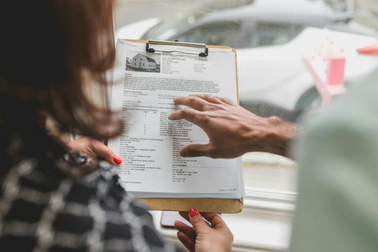 Couple looking through real estate document